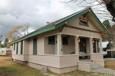Left side of home captures front porch with swing