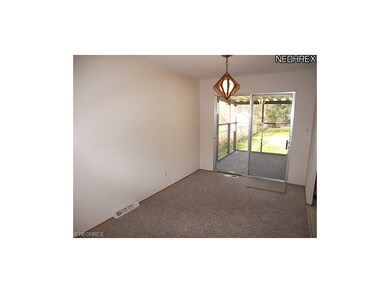 A screened patio off the dining room overlooks the