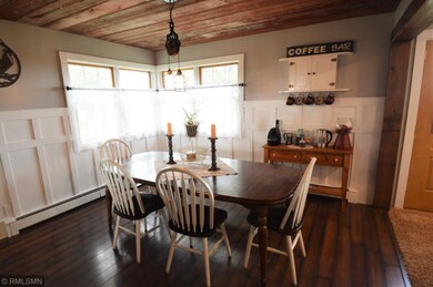 The dining room has a barn wood ceiling and lots o