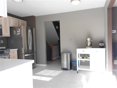 ANOTHER VIEW OF THE KITCHEN FROM THE DOOR THAT LEA