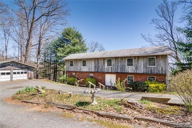 2 acres with detached two car garage and workshop.
