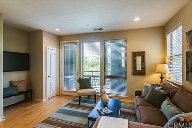 Living room opens up to the balcony that overlooks