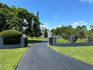View of driveway leading through the gate.