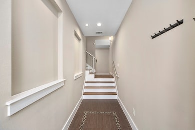 The entryway features custom paint and beautiful f