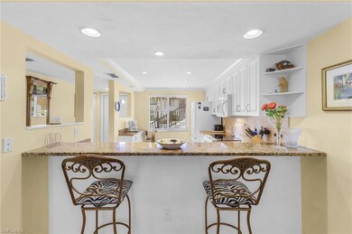 Kitchen with light stone countertops, a breakfast 