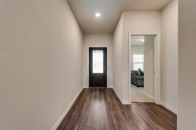 Entrance foyer with dark hardwood / wood-style floors