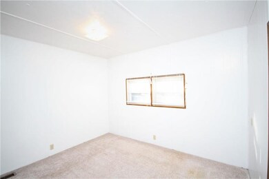 2nd bedroom features closets along the walls and a