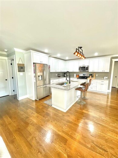 Kitchen w/Wood Flooring, Granite Counters, Recessed Lighting & Island