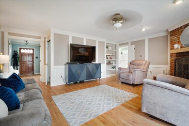Living area with built in shelves, wood finished f