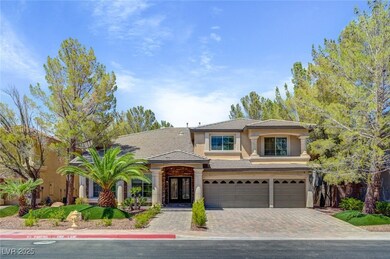 View of front facade featuring driveway, stucco si