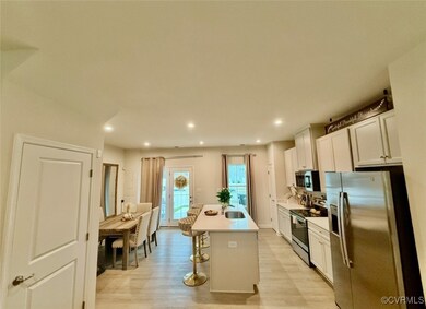 Kitchen featuring stainless steel appliances, ligh