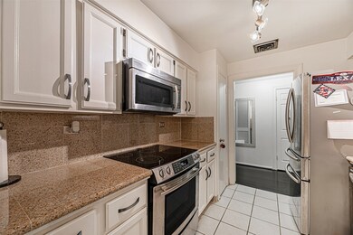 Galley kitchen with plenty of cabinet space plus r