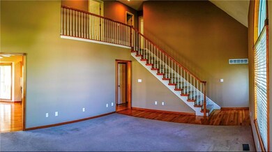 bEAutiful Staircase is trimmed in wood!  This home