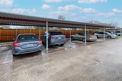 Covered parking lot with fence