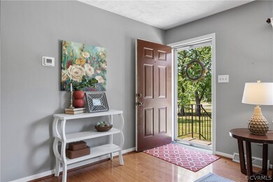Entrance foyer featuring light hardwood / wood-sty