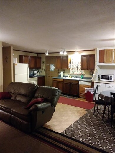 Living room looking into kitchen and dining area i