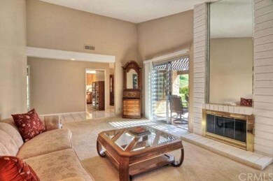 View in living room looking toward kitchen and hal