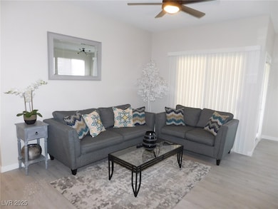 Living room featuring wood finished floors, a ceil