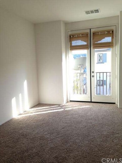 master bedroom with balcony