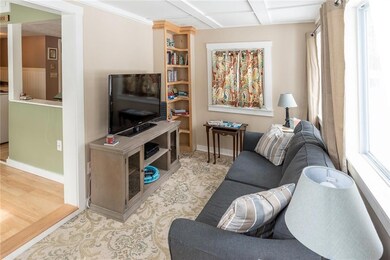 The living room boasts built-ins and...