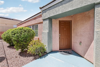 View of exterior entry with stucco siding