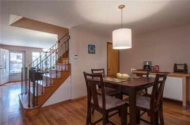 Gracious dining area with hardwood flooring and ch