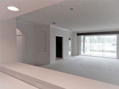 Kitchen to dining room, living room and den.