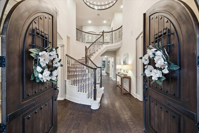 Grandeur entrance into this masterpiece with soaring ceilings, designer lighting, hardwood floors and double entrance stairs