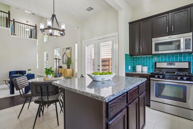 Kitchen featuring a notable chandelier, a center 