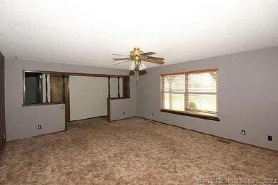 Looking out of living room toward entry