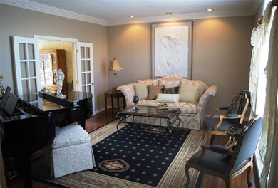 Bright Living Room with Hardwood Floors, Crown Mol