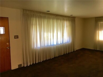 Huge Living Room with two windows.