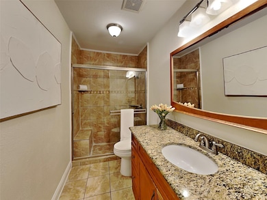 Full bathroom featuring tile patterned flooring, v