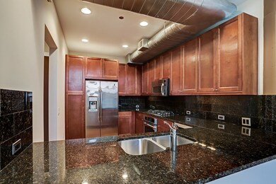 Another view of the Kitchen with plenty of room to set up drinks or a buffet.