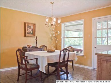 The dining room is open with an exit to the covere