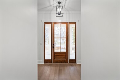 Step inside to find a beautiful foyer area with gorgeous 4 inch hardwood floors that flow throughout the home. Crown moldings, craftsman style door casings, and a designer foyer pendant give the feel of luxury as soon as you walk in the door.