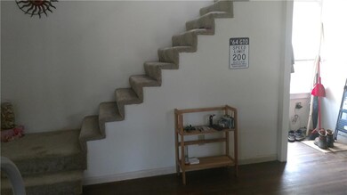 Stairs going up to bedrooms and full bath area!