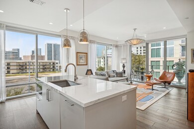 Another view of the kitchen to living room with fl