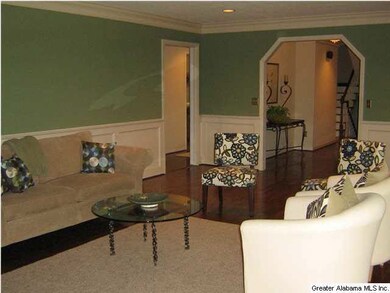 Living room is large and has a stacked rock firepl