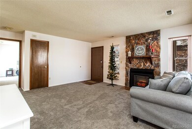 Spacious living room with fireplace.