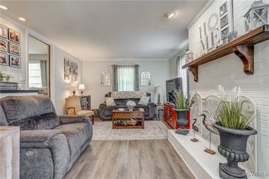 Family Room featuring light wood-style floors, orn