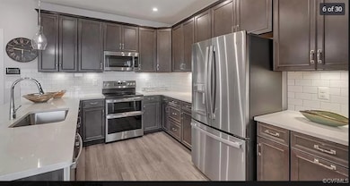 Kitchen featuring appliances with stainless steel