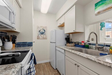 Coastal white kitchen with new azure tile backspla