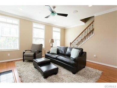 Family room with hardwood floors, neutral interior