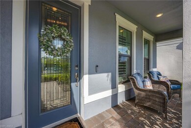 Doorway to property featuring covered porch and st