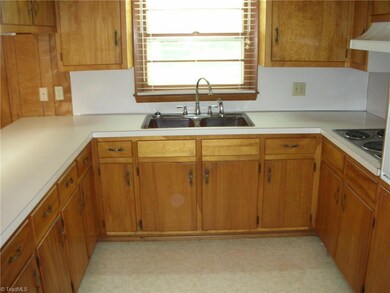 As you turn a bit you notice that the window is right above the sink so that you can look out into the backyard and make sure the kids are doing ok and playing. You might even have a pet out there that they are playing with. Not to worry because the backyard id fenced in.