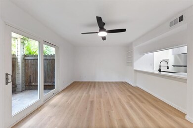 Bright living area with wood flooring, modern ceil