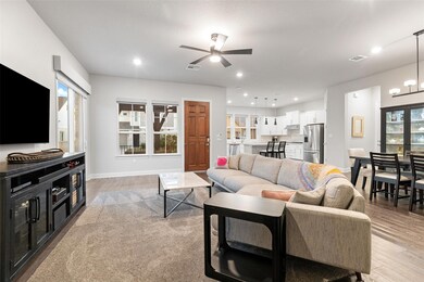 Living room with light wood-style flooring, reces