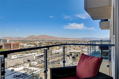Balcony featuring a view of city and a mountain vi