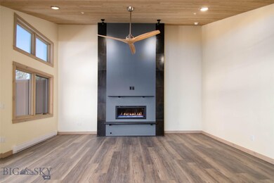Mountain modern propane fireplace with rustic iron
